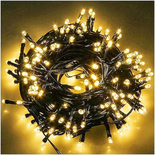 Fairy Black String Lights with Memory Function. Extendable 33ft 100 LED Plug in Cozy Warm White Decorations for Christmas Xmas Tree, Garden, Party, or Home, creating magical indoor outdoor Ambiance